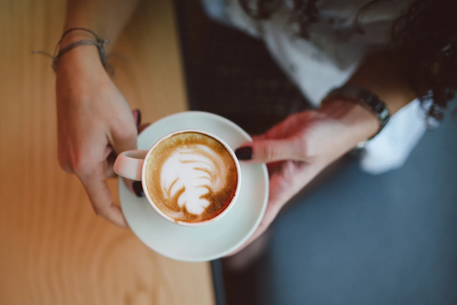 A cappuccino with latte art. The photo was not taken at a Sandy Springs cafe.
