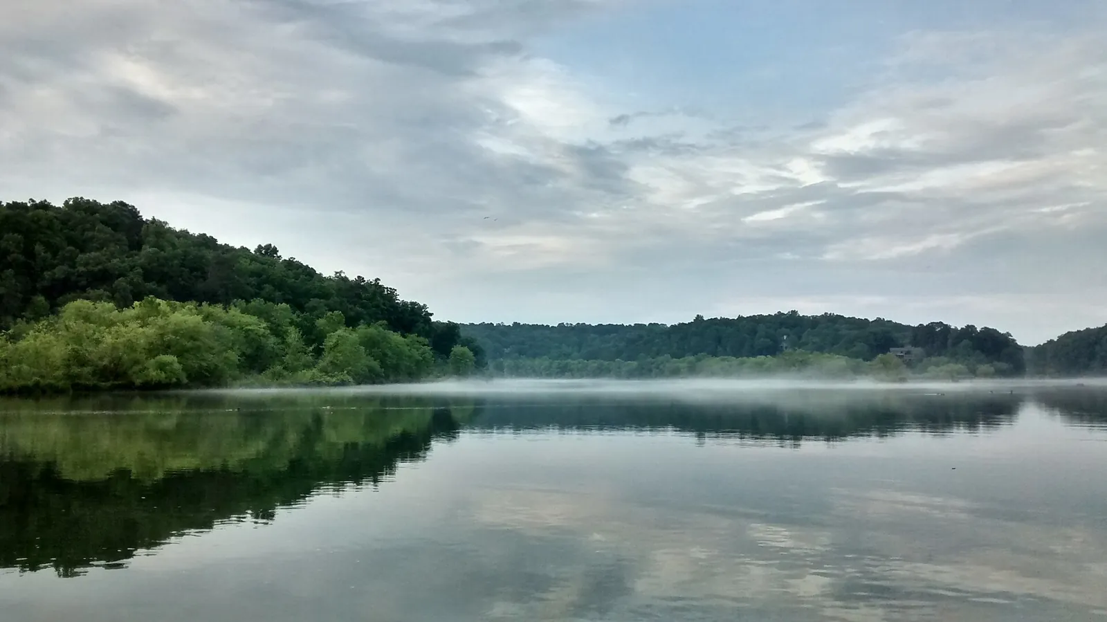 Morning mist on Bull Sluice Lake at Morgan Falls Overlook Park, home of the city's Dino Egg Hunt