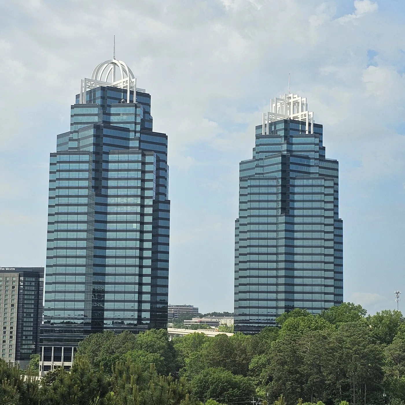 The Concourse at Landmark Center towers above the trees in Sandy Springs