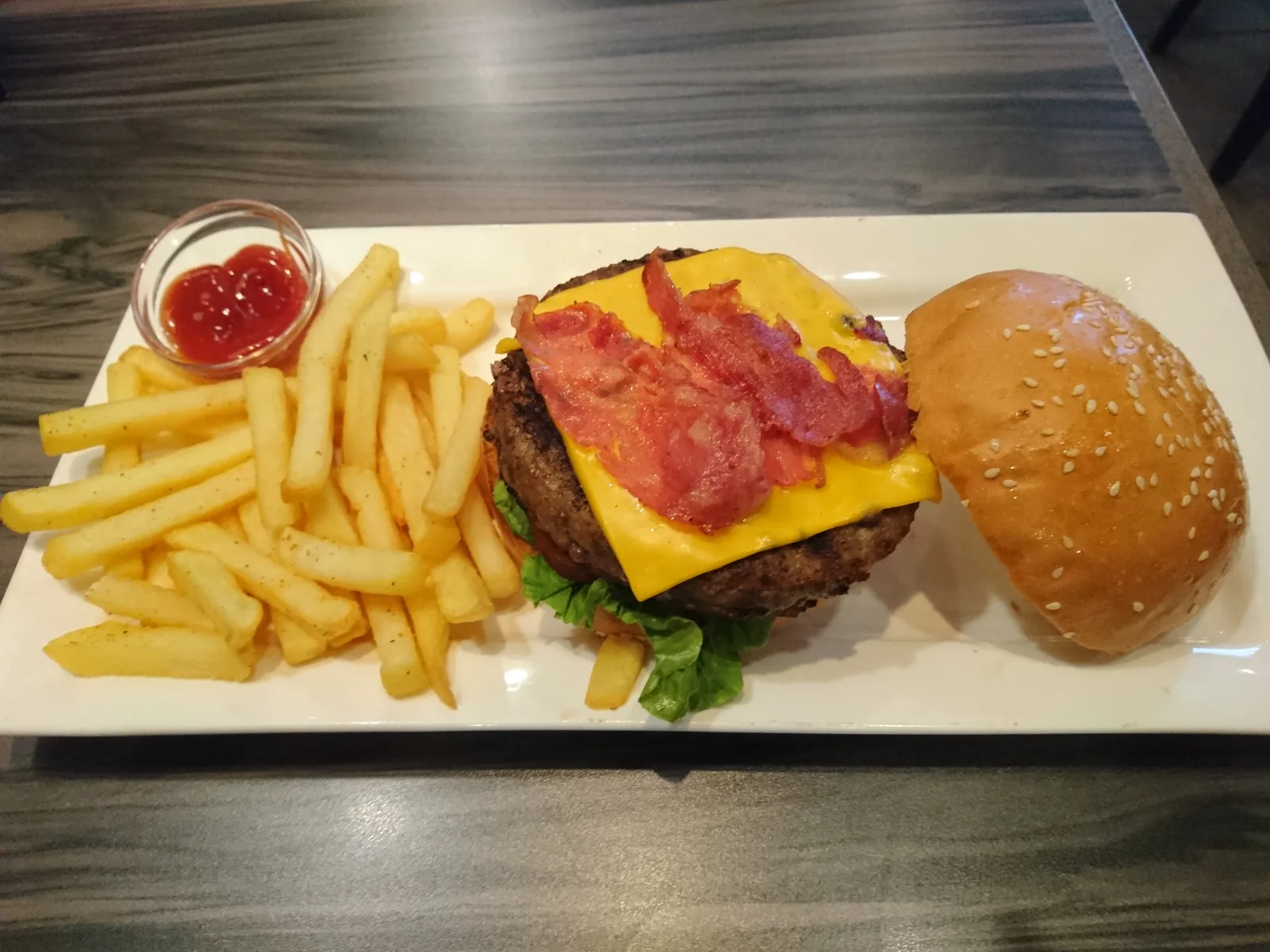 A bacon cheeseburger with fries. The photo was not taken at a Sandy Springs restaurant.